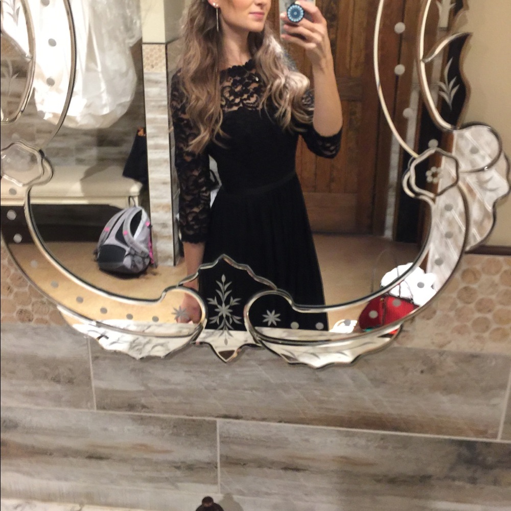 Long black lace wedding guest dress.